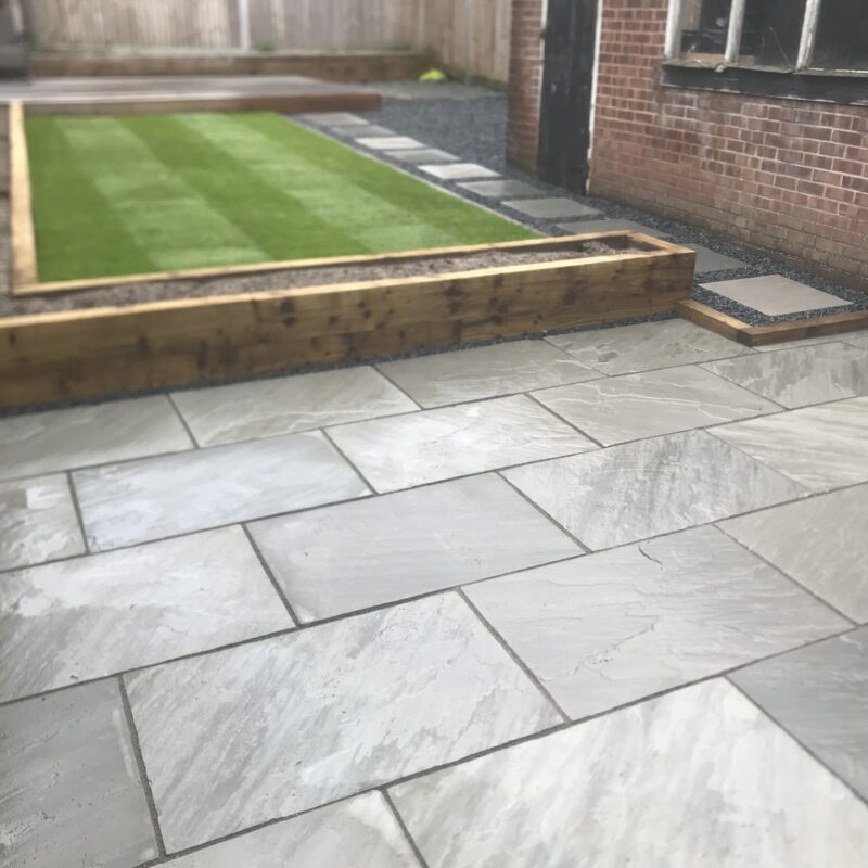 Sandstone Patio Area, in Grey. Along with Sleeper-Work and Artificial Lawn (2)
