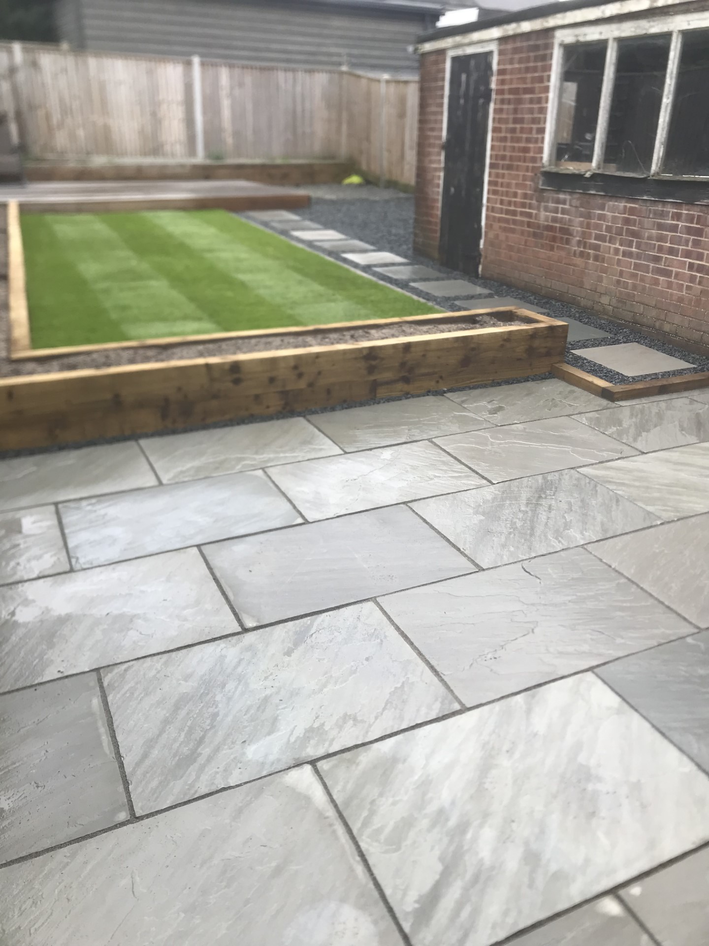 Sandstone Patio Area, in Grey. Along with Sleeper-Work and Artificial Lawn (2)